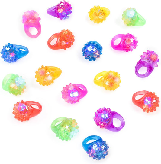 Super Z Outlet Flashing Colorful LED Light Up Bumpy Jelly Rubber Rings Finger Toys for Parties, Event Favors, Raves, Concert Shows, Gifts (18 Pack)