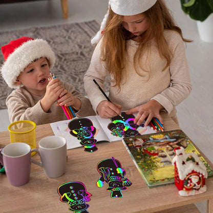 JarThenaAMCS 120Pcs Winter Snowman Scratch Paper Rainbow DIY Scratch Art Magic Scratch Off Cutout with 120Pcs Ribbons 60Pcs Wooden Styluses for Christmas Craft Party Game